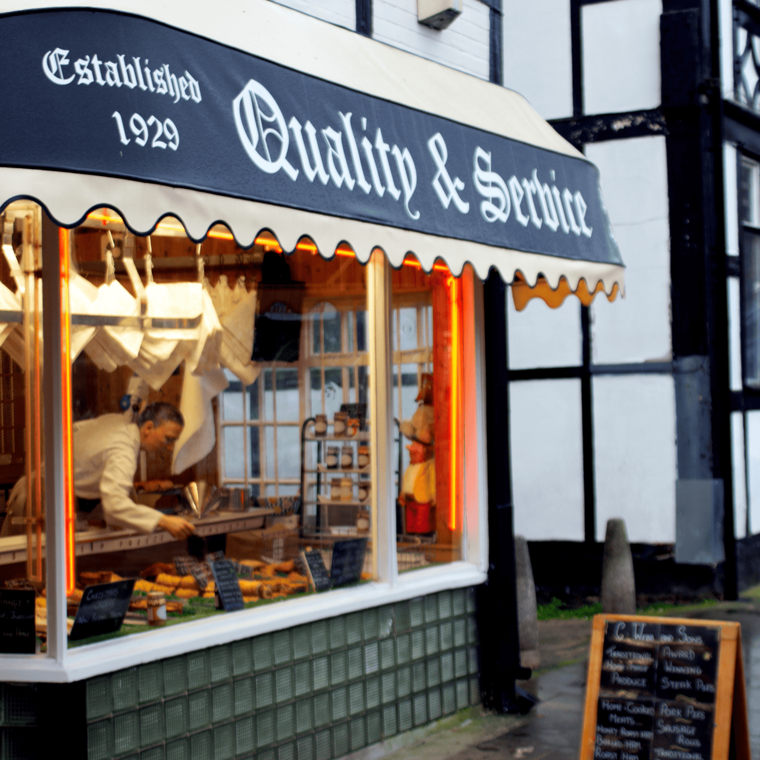 A portrait image of outside the C webb & Sons Butchers Shop on 56-58 Witton Street Northwich
